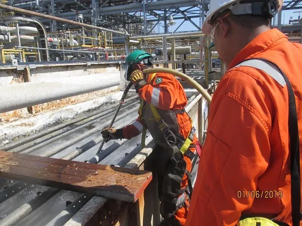 PT. HTSI technicians on an industrial platform